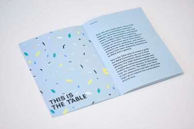 Front page of a This is The Table zine opened to the first page and introduction text